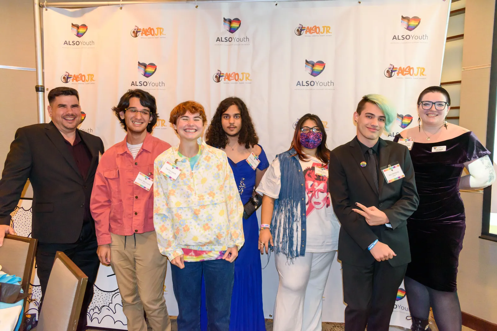 Young people and adults posing together in front of the ALSO Youth backdrop at the 30th anniversary gala.